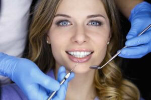 smiling woman has dental procedures done
