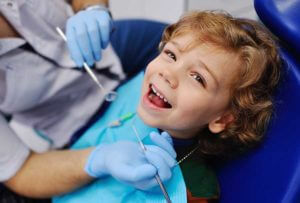 smiling child benefits from family dentistry