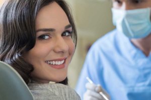 smiling woman wants to know more about dental insurance in florida
