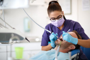 Dental hygienist prepping a patient for dental sealants